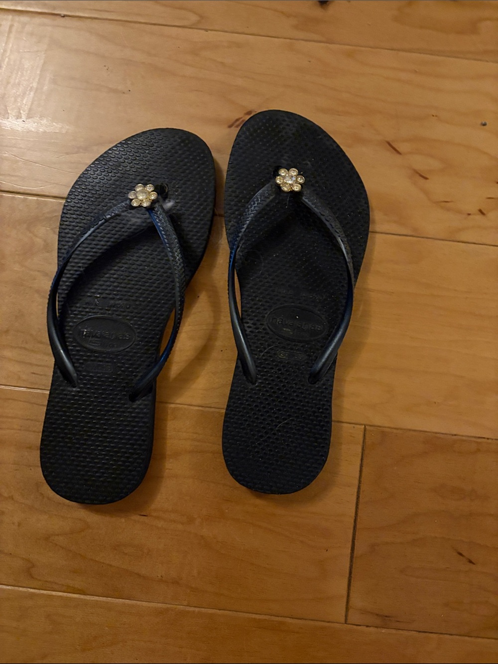 Havaianas Black Flip Flops with Gold Flower Charm
